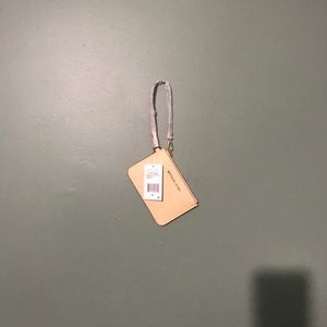 Brand new cream colored Michael kits wristlet